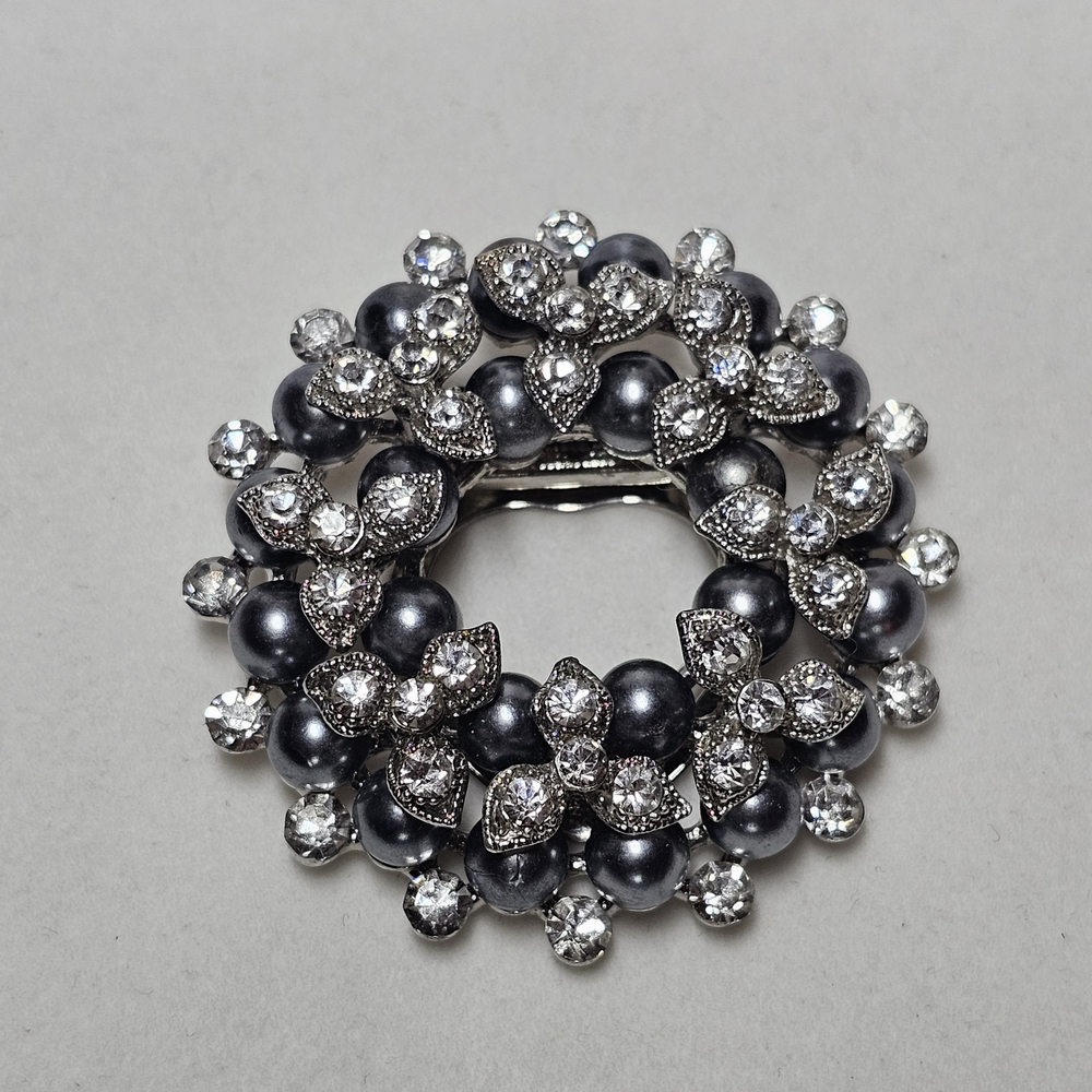Elegant Silver and Black Brooch